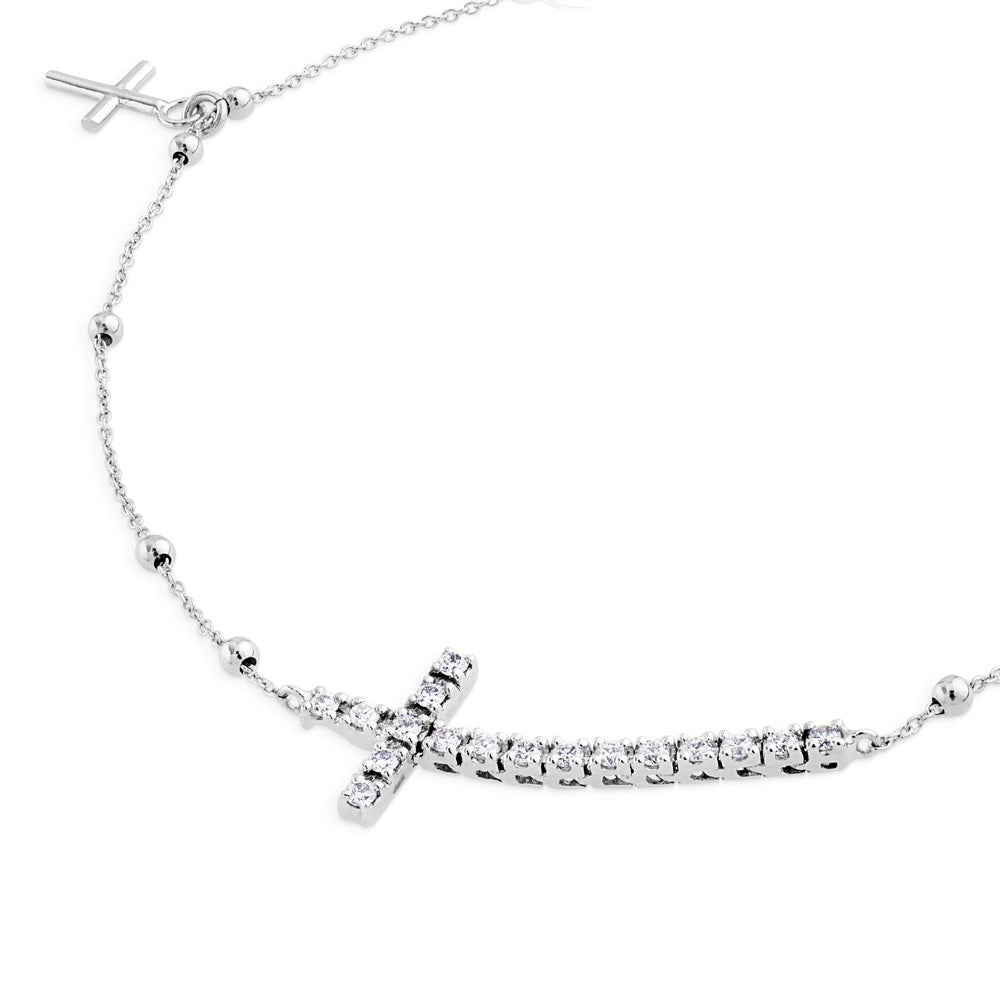 Pulsera de oro blanco con cruz horizontal de diamantes