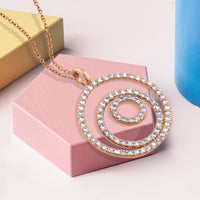 Colgante_GeometriCh_de_oro_rosa_con_círculos_de_pavé_de_diamantes