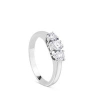 Tresillo de oro blanco con diamantes engastados en garras