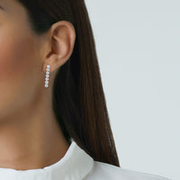 Pendientes riviere de oro blanco con 14 diamantes en garra