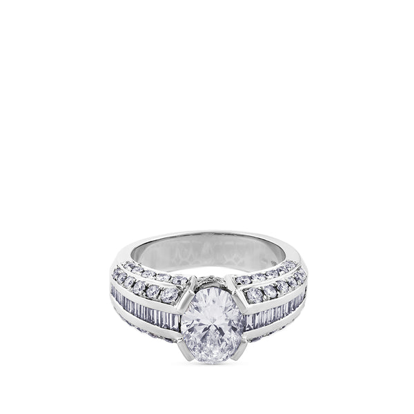 Solitario de oro blanco con diamante oval y diamantes talla baguette y brillante en montura