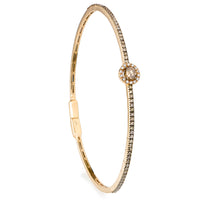 Pulsera_rígida_de_oro_con_brillante_central_Brown_vista_vertical