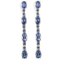 Pendientes_largos_de_oro_blanco_con_diamantes_talla_brillantes_y_zafiros_azul_talla_oval