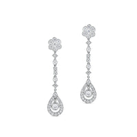 Pendientes largos de oro blanco con diamantes, flor y lágrima de diamantes