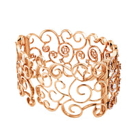 Pulsera ancha rígida de oro rosa con diamantes y pavé de diamantes