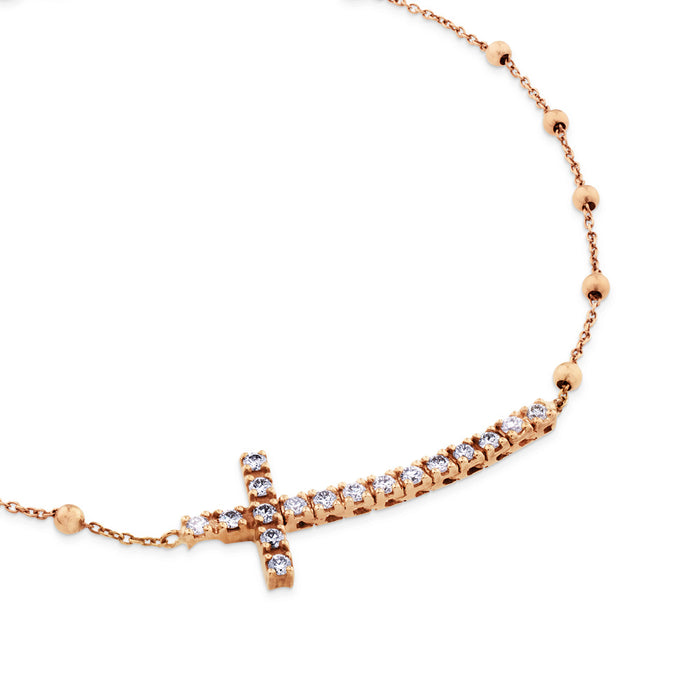 Pulsera de oro rosa con cruz horizontal de diamantes