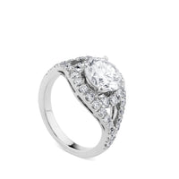 Sortija de oro blanco con diamante central talla brillante y pavé de diamantes