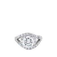 Sortija de oro blanco con diamante central talla brillante y pavé de diamantes