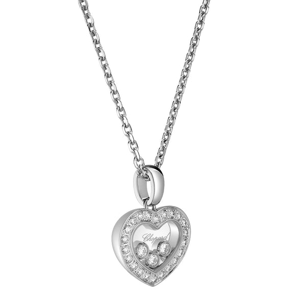 Colgante de oro blanco con corazón de brillantes y tres diamantes móviles entre dos cristales de zafiro.