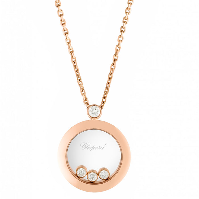 Colgante de oro rosa en forma de círculo y diamante fijo, y tres diamantes móviles entre dos cristales de zafiro.