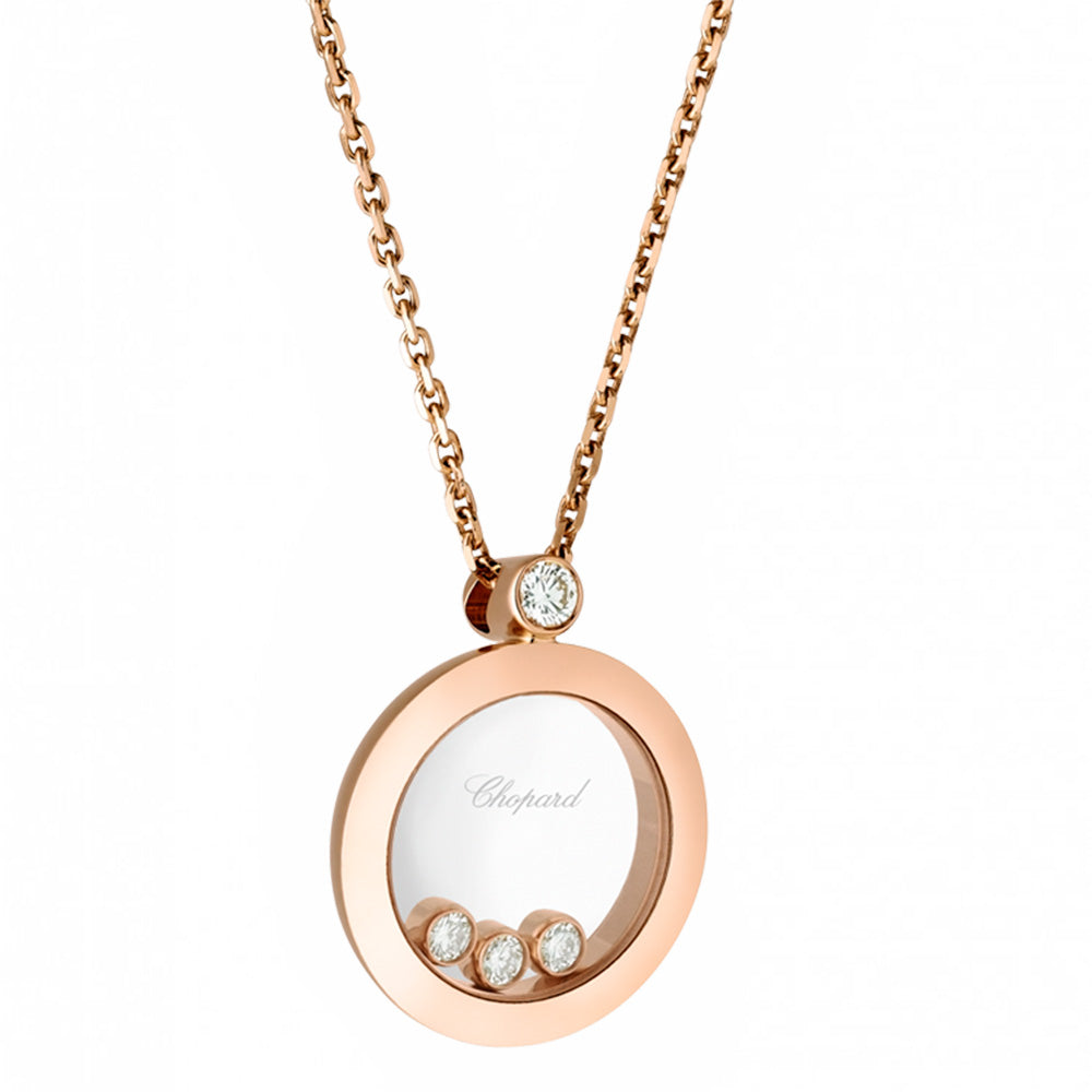 Colgante de oro rosa en forma de círculo y diamante fijo, y tres diamantes móviles entre dos cristales de zafiro.