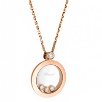 Colgante de oro rosa en forma de círculo y diamante fijo, y tres diamantes móviles entre dos cristales de zafiro.