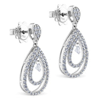 Pendientes largos de oro blanco con lagrimas de diamantes y diamante al aire