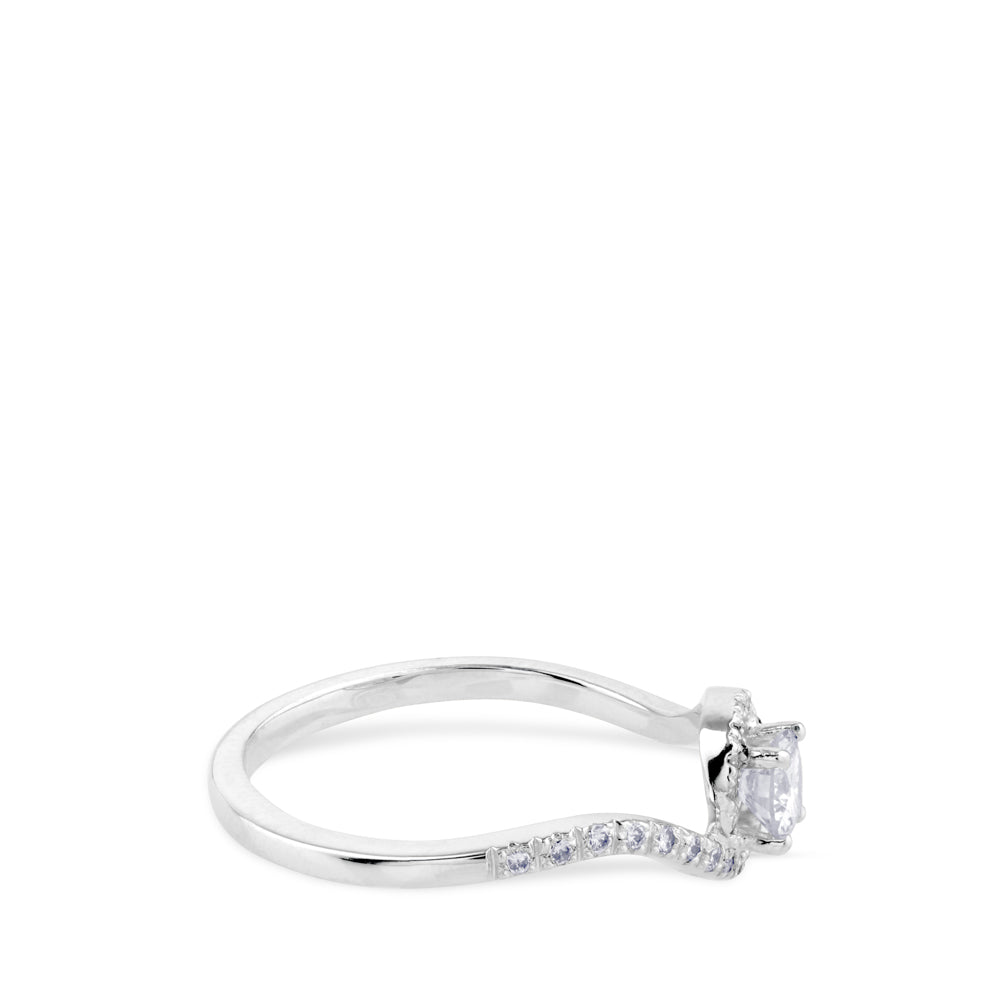 Solitario de oro blanco de 0,29 quilates engastado en 4 garras con orla de pavé de brillantes