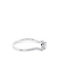 Solitario de oro blanco de 0,29 quilates engastado en 4 garras con orla de pavé de brillantes