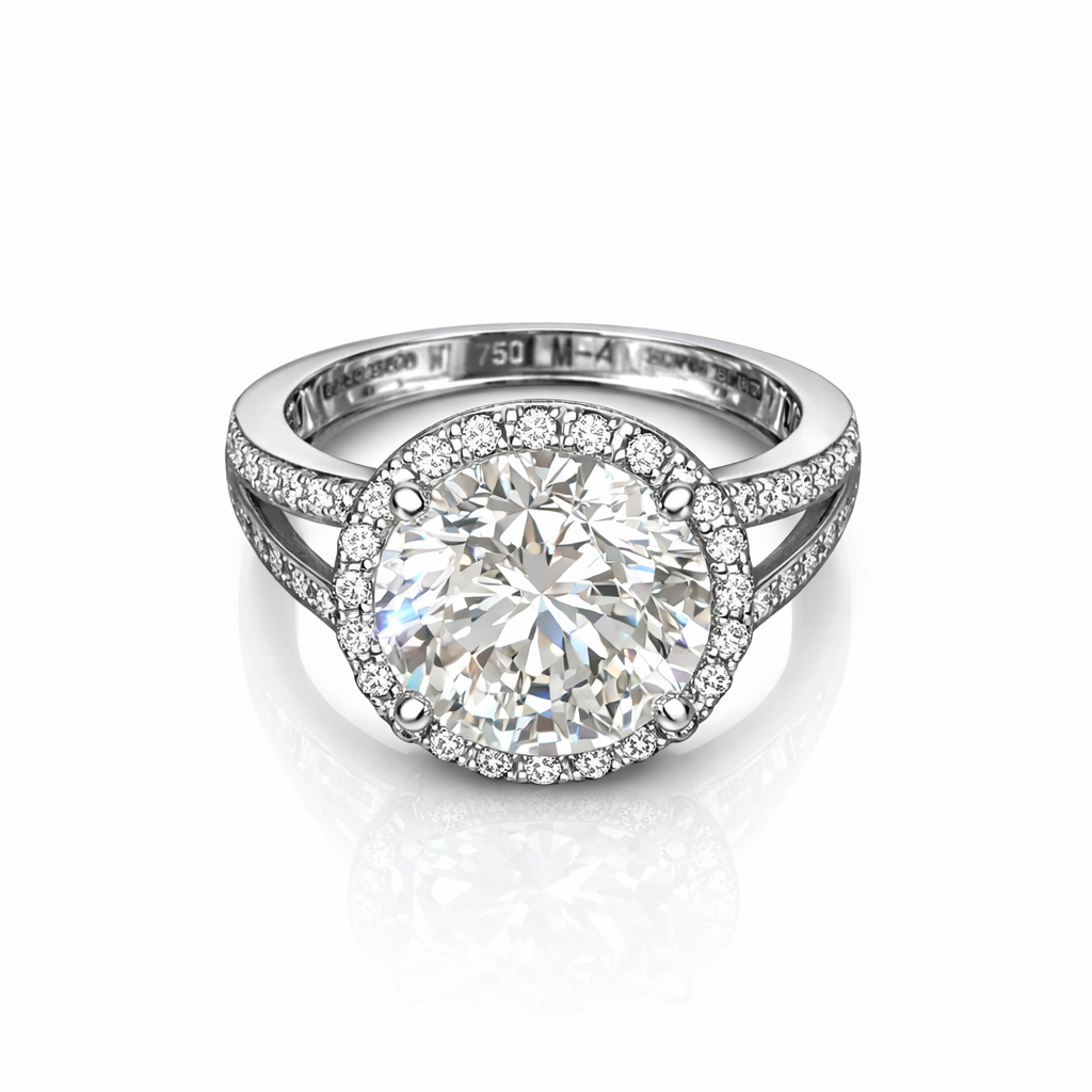 The Solitario sortija de oro blanco con diamante central 5cts talla brillante y orla de diamantes