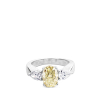 Sortija de oro blanco con diamantes y diamante fancy amarillo