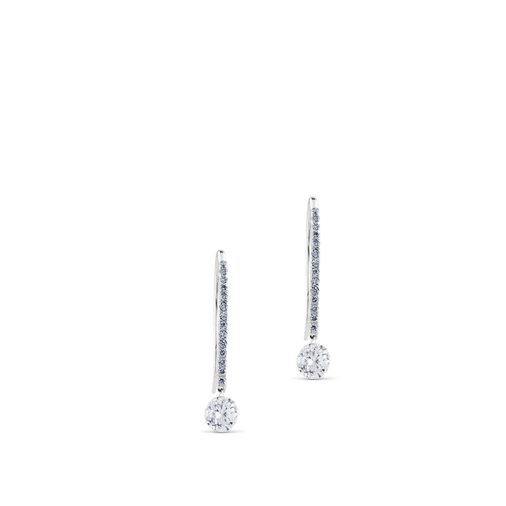 Pendientes de oro blanco con hilera de diamantes y diamante al aire
