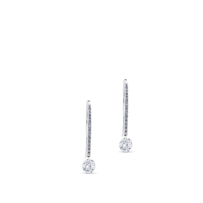 Pendientes de oro blanco con hilera de diamantes y diamante al aire