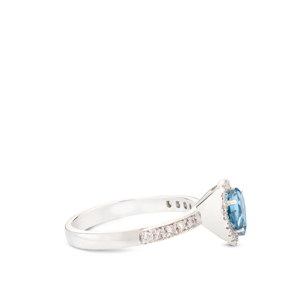 Sortija de oro blanco con diamantes y topacio azul talla pera