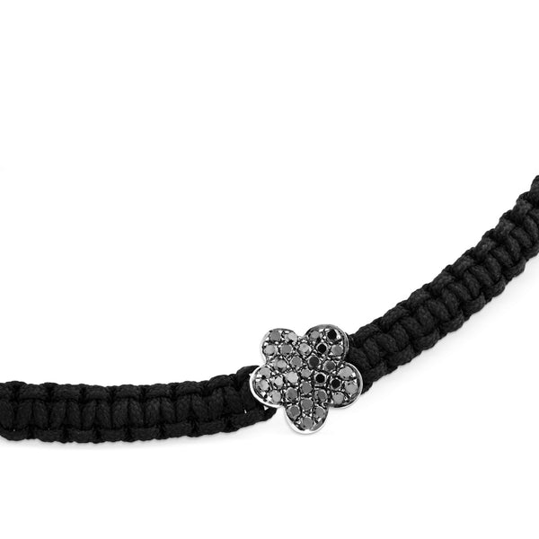 Pulsera de cordón negro con flor de oro blanco y diamantes negros