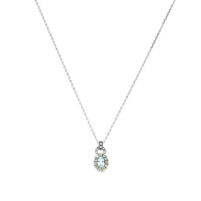 Colgante de oro blanco con diamantes y topacio azul con orla de pavé de diamantes