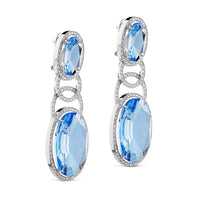 Pendientes largos de oro blanco con circulos de diamantes y cuarzo azul