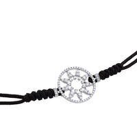 Pulsera de oro blanco y cordón negro con estrella en aro de pavé de diamantes