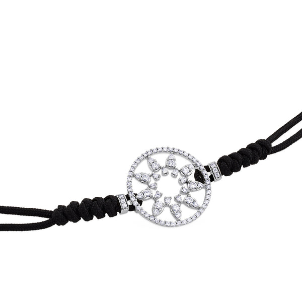 Pulsera de oro blanco y cordón negro con estrella en aro de pavé de diamantes