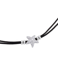 Pulsera de oro blanco y cordón negro con estrella de pavé de diamantes