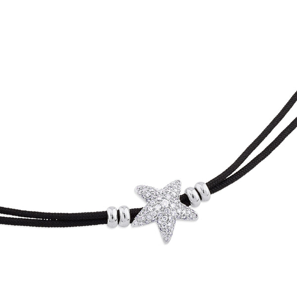 Pulsera de oro blanco y cordón negro con estrella de pavé de diamantes