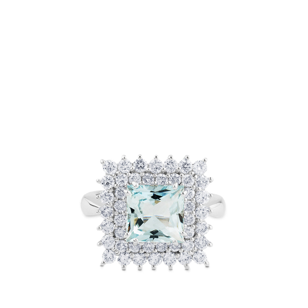 Sortija de oro blanco con aguamarina y orla de diamantes