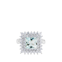 Sortija de oro blanco con aguamarina y orla de diamantes