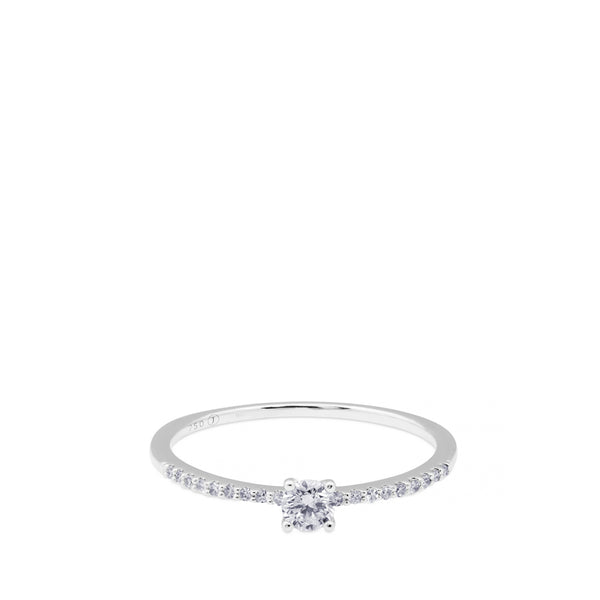 Solitario "Isabella" de oro blanco con diamante talla brillante y diamantes en garra