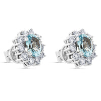 Pendientes de oro blanco con aguamarina y orla de 20 diamantes