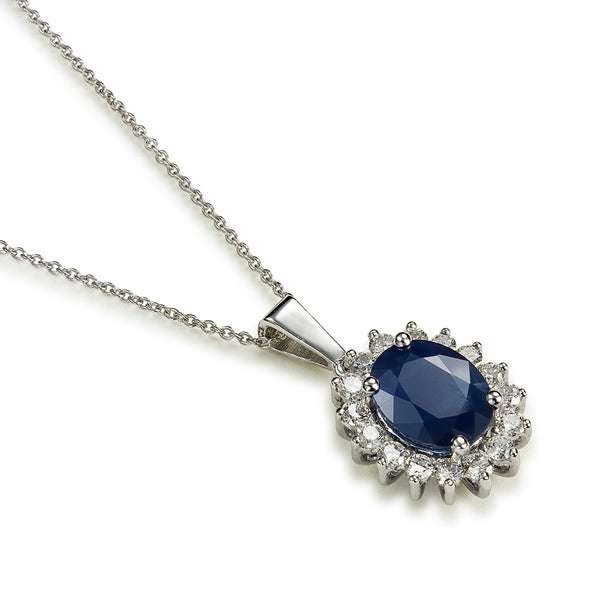 Colgante "Royal Trilogy" de oro blanco con zafiro oval y orla de diamantes