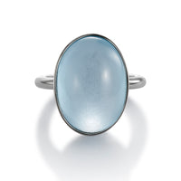 Sortija de oro blanco con topacio oval